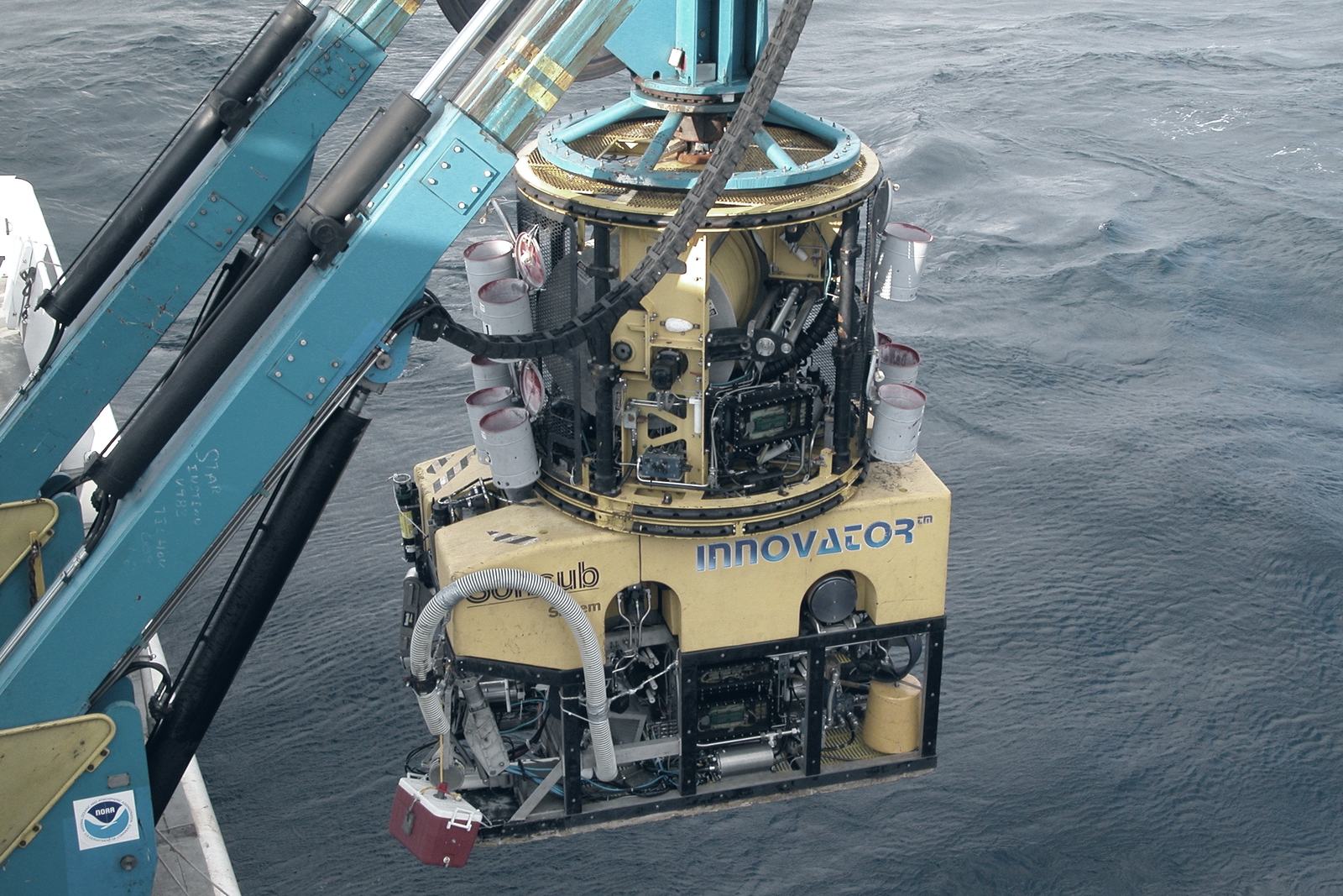 A remotely operated vehicle being deployed over the side of a vessel